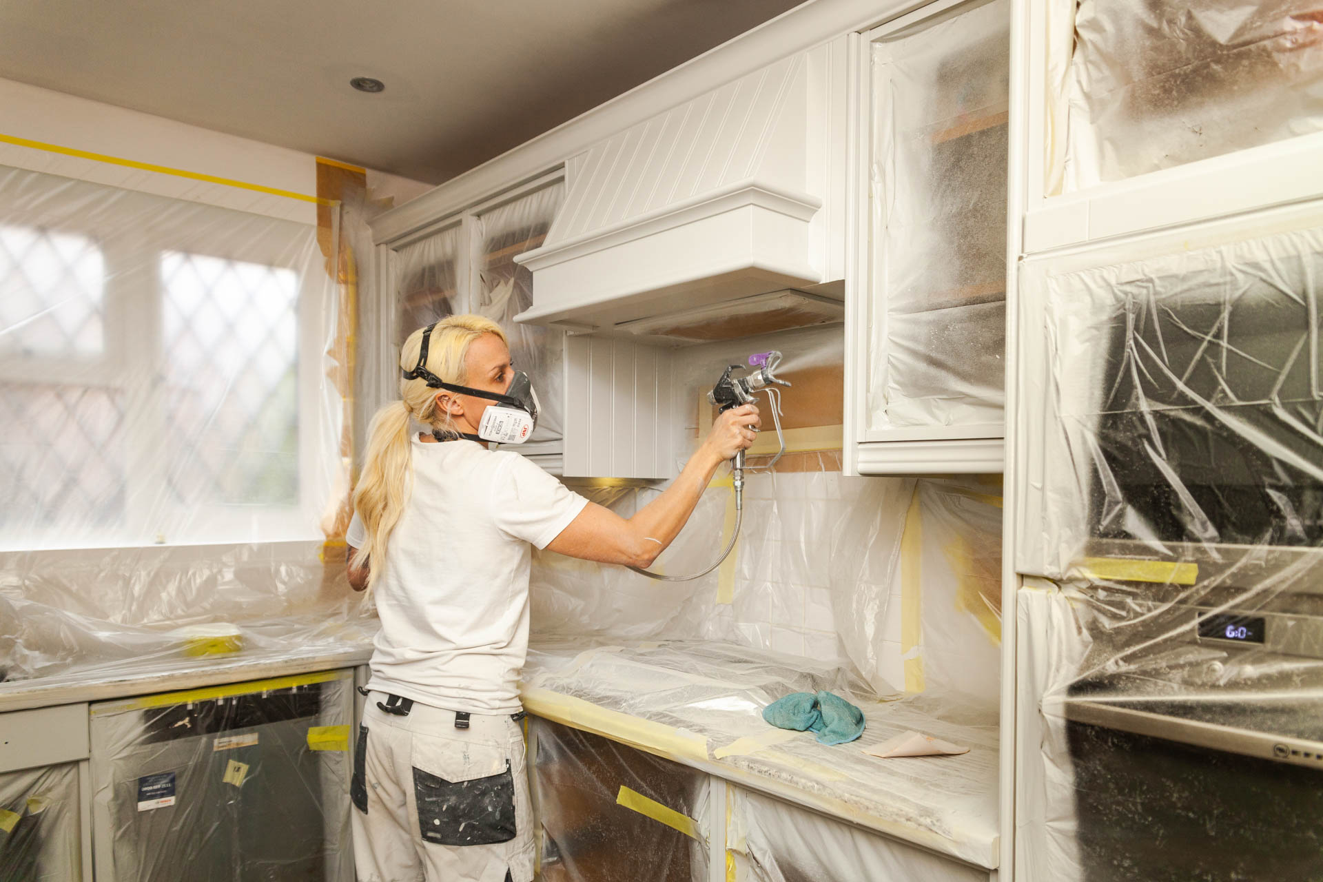 spray painting a kitchen
